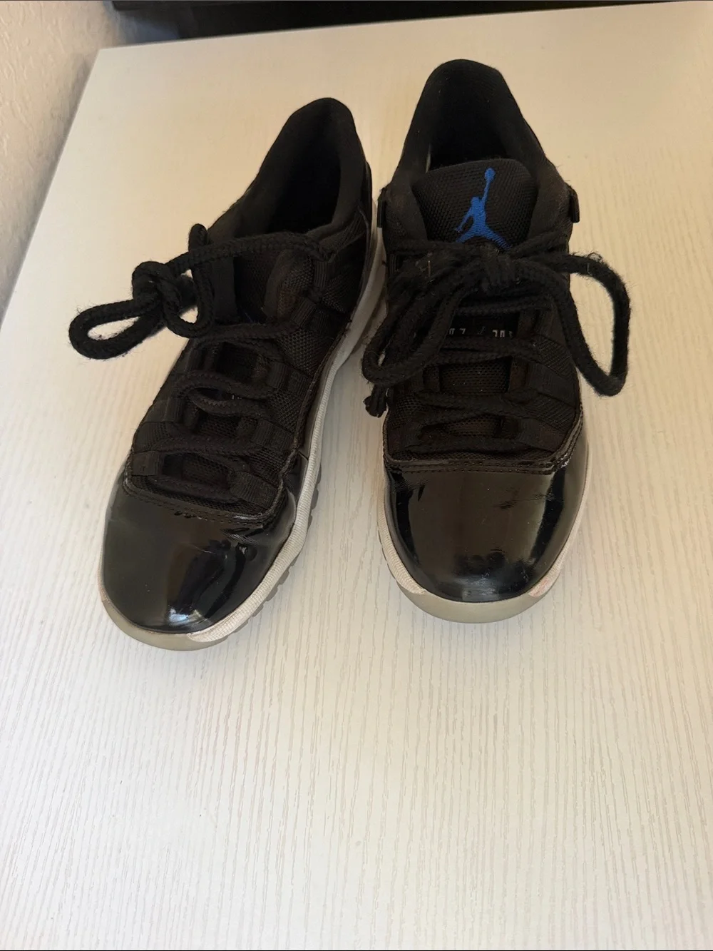 Jordan low 11’s Kids Black Basketball Sneakers with Blue Logo